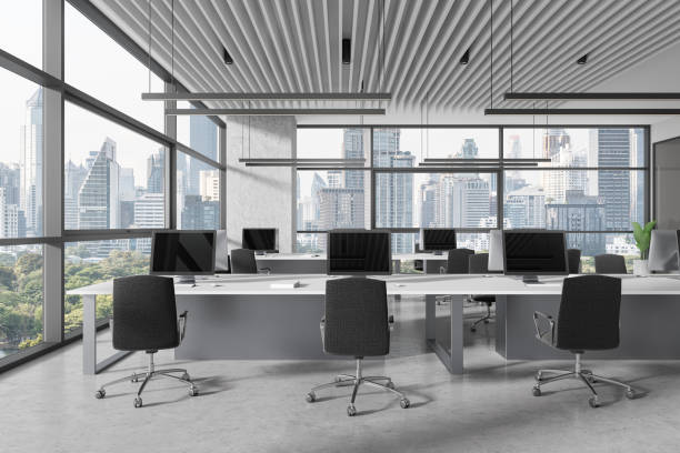 istock Office interior with desk and pc desktop in row, panoramic window 1970330415