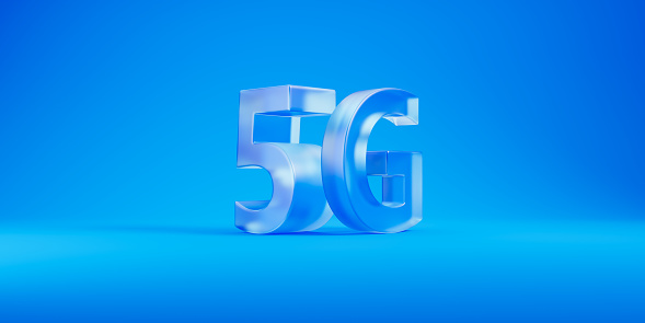 View of blue glass 5G sign over blue background. Concept of communication, telecommunication and internet connection. 3d rendering