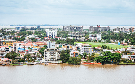 Aerial view of Ibirapuera park in Sao Paulo city, Brazil. Prevervetion area with trees and green area of Ibirapuera park. Office buildings and apartments in the background on a sunny day.