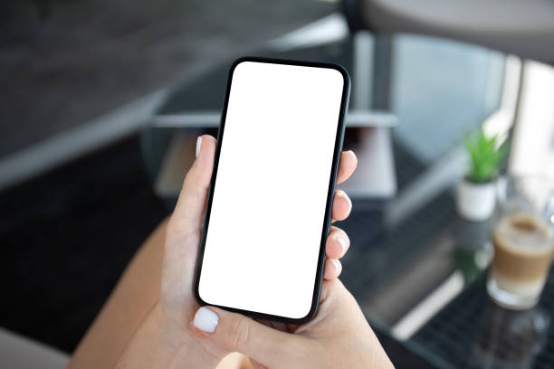 istock female hand hold phone with isolated screen summer cafe office 1970332546