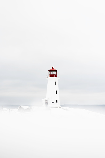 Peggy's Point Lighthouse in Nova Scotia. Winter scene.