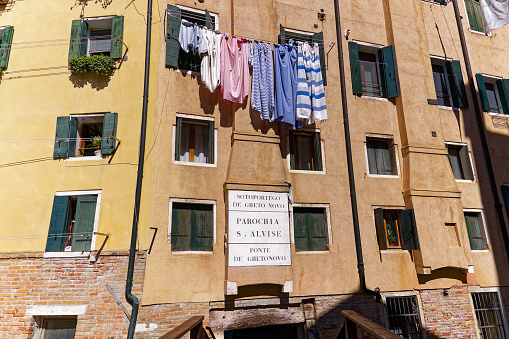 Old town of Italian City of Venice with street name sign at Gheto Novo on a sunny summer day. Photo taken August 7th, 2023, Venice, Italy.