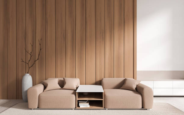 istock Stylish home living room interior with couch and coffee table, empty wall 1970338369