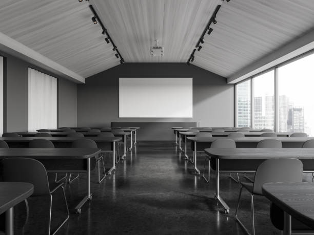 istock Grey classroom interior with chairs in row, window and mock up projection screen 1970342634