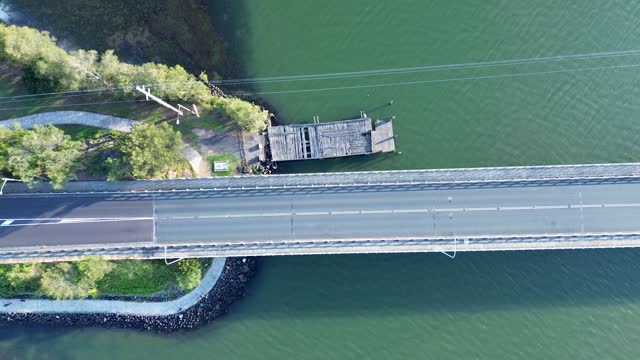 Drone aerial landscape cars driving on Toukley bridge travel transport infrastructure Gorokan boat ramp wharf Central Coast Australia