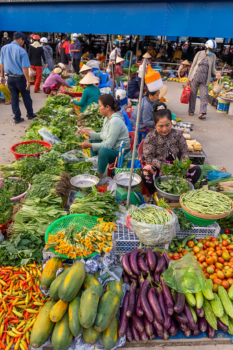 Hau Giang province, Vietnam - 25 Jan 2024: Busy local daily life of the morning local market in Vi Thanh or Chom Hom market, Vietnam. People can seen exploring around the market.