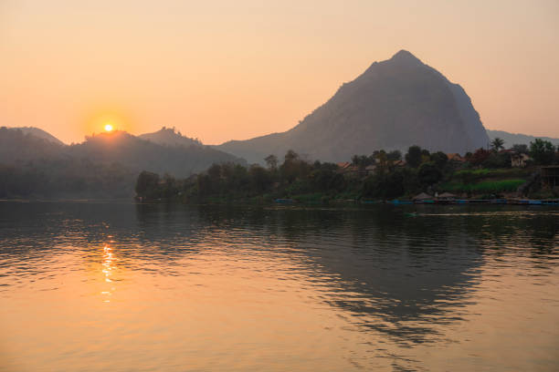 istock Colourful sunset over Mekong river in Laos 1970366338