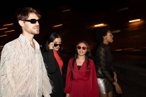 istock Fashionable Friends Striding Through the Night 1970449227