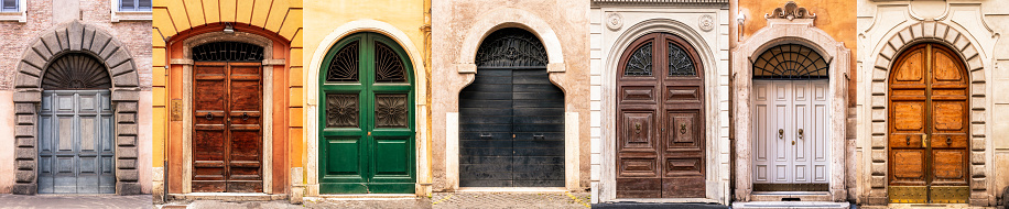 Old wooden door in the medieval city in Italy