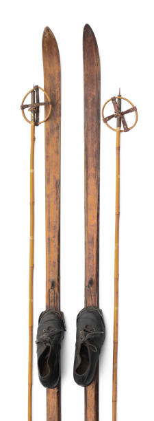 old wooden skis with boots isolated on white background