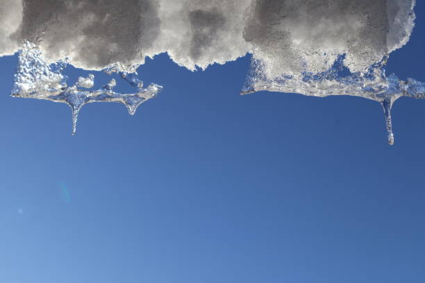 Blue sky with snow and ice from above.