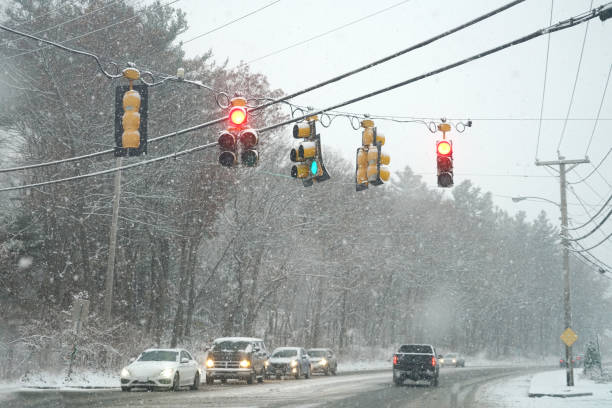 istock traffic light in street crossing on snowing day 1970472913
