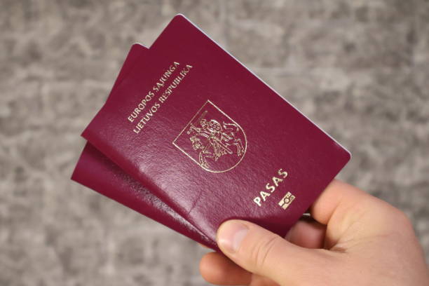 istock Two Lithuanian passports are held in hand. 1970475549