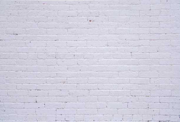 facade view of old white brick wall background