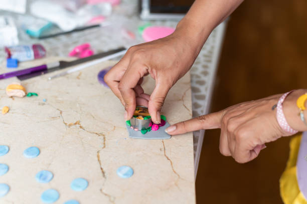 istock Artisan carving a piece of polymer clay in the workshop 1970477640