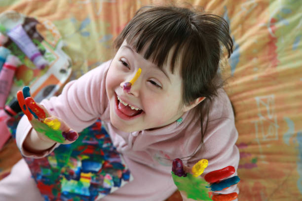 Cute little girl with painted hands