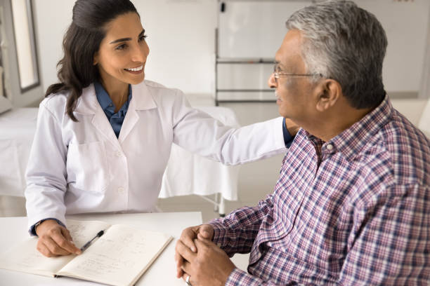 istock Happy young practitioner woman giving comfort to older Indian patient 1970502425