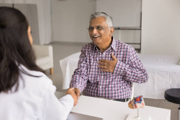 istock Happy older Indian patient shaking hands with younger therapist 1970508724