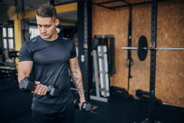 istock Man weightlifting with dumbbells 1970510841
