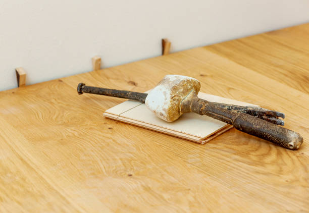 istock Traditional and ancient tools for laying parquet. 1970530349