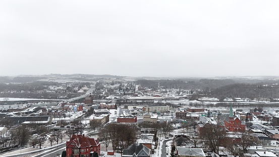 Bird's eye view of snowy cityscape with buildings