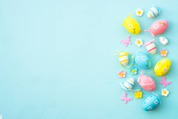 istock Easter background with Eggs, rabbit and spring flowers at blue background. 1970572900