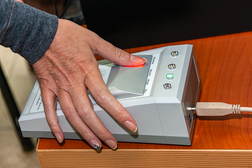 biometric security fingerprint, woman using the scanner