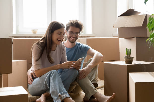 istock Young couple buying goods for new house using smartphone application 1970638999