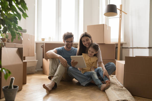 istock Young family browse renovation websites on internet on relocation day 1970651249