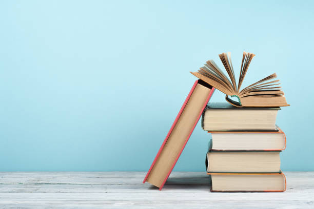 istock Open book, hardback colorful books on wooden table. Back to school. Copy space for text. Education business concept. 1970657992