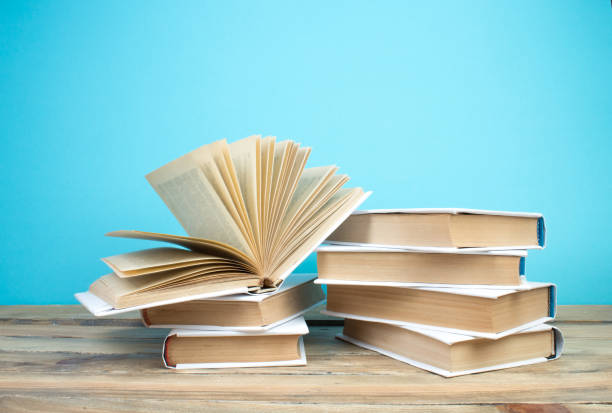 istock open book, books on the blue background. Back to school. Education. Copy space for text. 1970658770