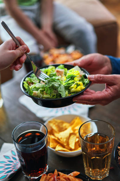 istock Enjoying Grilled Chicken Caesar Salad Delivery Bowl 1970675086