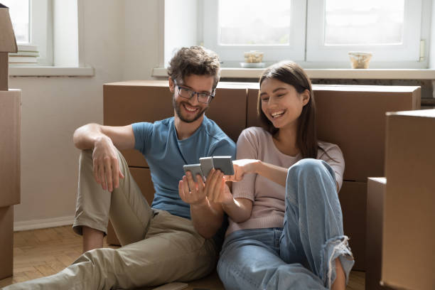 istock Couple planning renovation, discussing interior design on relocation day 1970689755