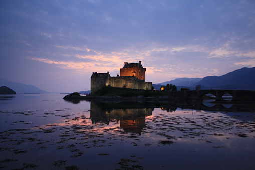 Dornie, Scotland, UK - 09/12/2014: Sunset in Eilean Donan Castle