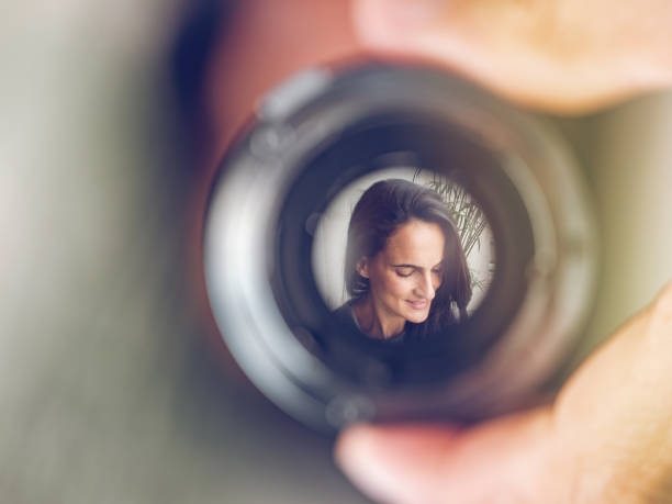 istock Lens with reflection of charming woman 1970705219
