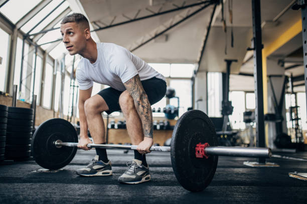 istock Man weightlifting in gym 1970705732