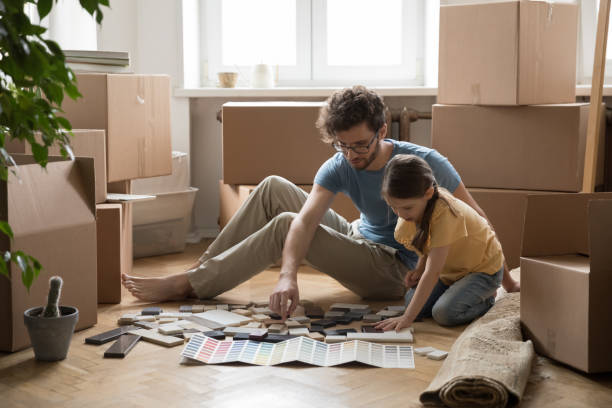 Father and daughter choosing samples for house decoration
