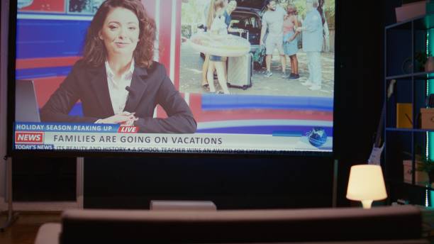istock Streaming service travelling channel on widescreen television set left turned on, panning shot 1970777677