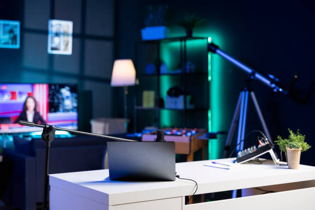 istock Empty home studio interior illuminated with neon lights at night, used for internet video production 1970787204