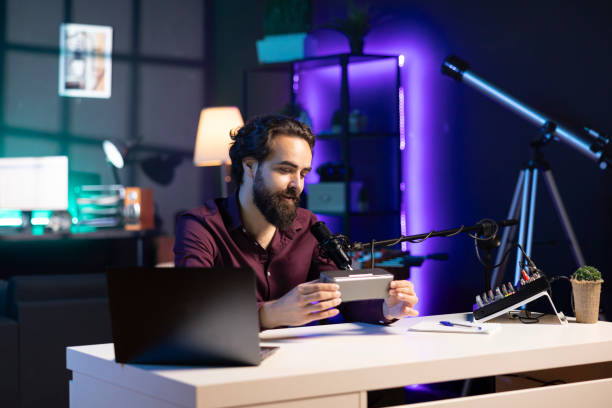 istock Happy internet star doing technology review of Bluetooth portable speaker 1970795593