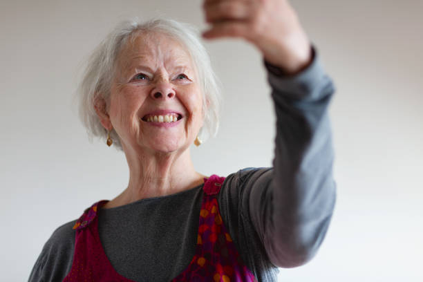 istock Happy Senior Woman using phone making a selfie 1970813237