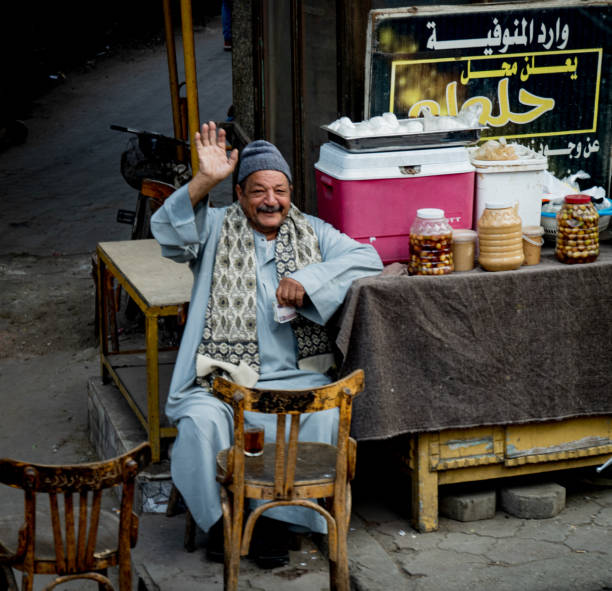 Indian street seller selling tea- masala chai in Jaipur. Masala chai is a beverage from the Indian subcontinent made by brewing tea with a mixture of aromatic Indian spices and herbs. Jaipur is the capital city of Rajasthan. Jaipur is known as the Pink City, because of the color of the stone exclusively used for the construction of all the structures.