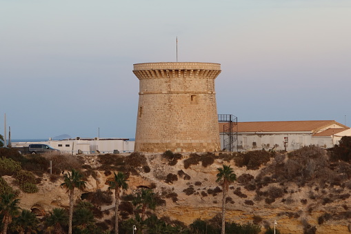 El Campello, Alicante, Spain, January 28, 2024: La Isleta defensive tower used in the Middle Ages in El Campello, Alicante, Spain