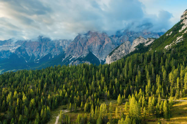 istock Giant forestry mountains with bare rocky peaks at sunset 1970913990