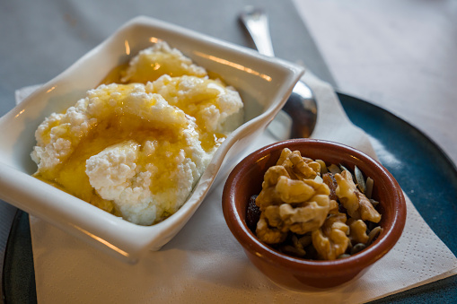 Homemade cottage cheese with honey and nuts for dessert Catalonia Spain Healthy food.selective focus.
