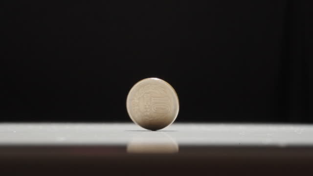Japanese 10 Yen Coin Spinning on Table