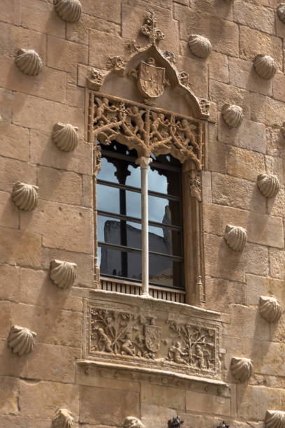 istock View of a window facade, plateresque style, traditional pattern texture wall on shell house facade, Casa de las Conchas, on Salamanca 1970987951