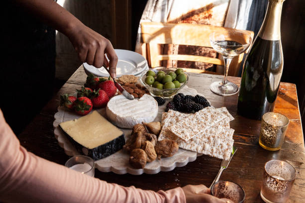 istock Three Female Friends Enjoying Appetizers and Champagne 1970999625