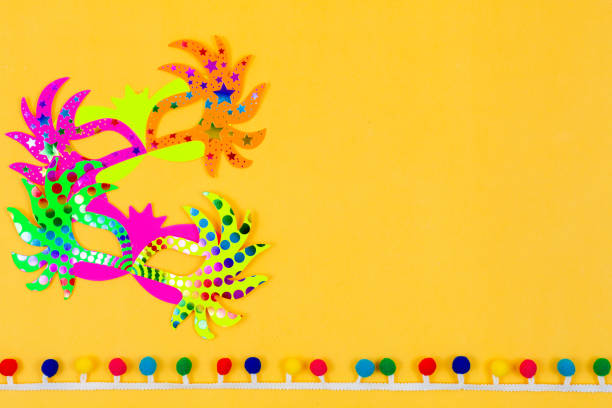 Carnival masks on colored background