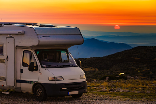 Camper rv camping in mountains at sunset. Portugal. Adventure with motor home.
